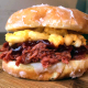 Image for article titled Hey you, pulled pork mac & cheese on a glazed doughnut—in my mouth, now!